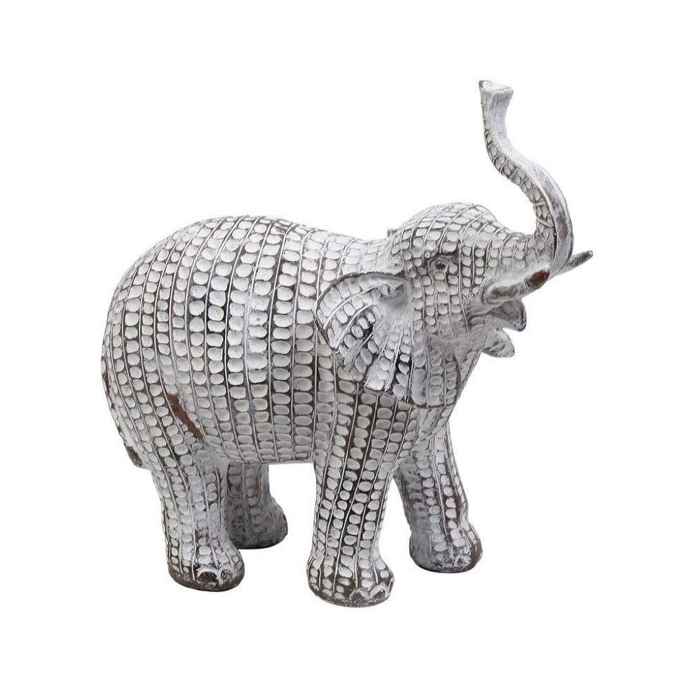 Ένας μεγάλος μπεζ ελέφαντας με λευκές βούλες και σηκωμένη προβοσκίδα