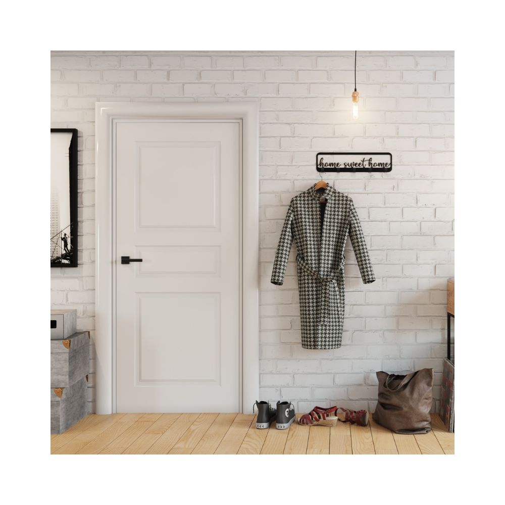 Ένα μοντέρνο δωμάτιο σε λευκές αποχρώσεις και κρεμάστρα home sweet home